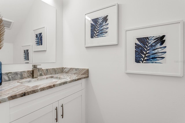 bathroom with visible vents and vanity