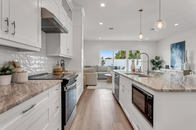 kitchen with electric range, stainless steel dishwasher, a sink, wall chimney range hood, and black microwave