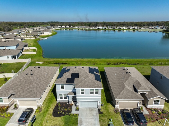 bird's eye view with a residential view and a water view