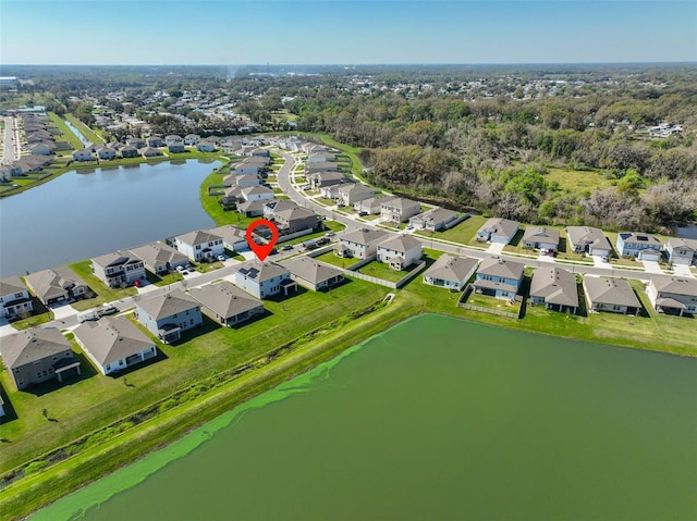 birds eye view of property featuring a water view and a residential view