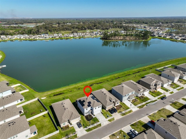 bird's eye view featuring a water view and a residential view