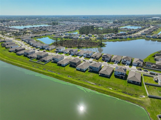 birds eye view of property with a residential view and a water view