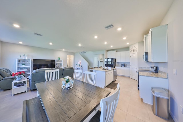 dining room with light tile patterned floors, visible vents, and recessed lighting