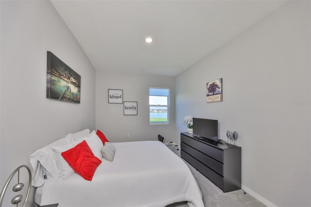 bedroom featuring carpet and baseboards