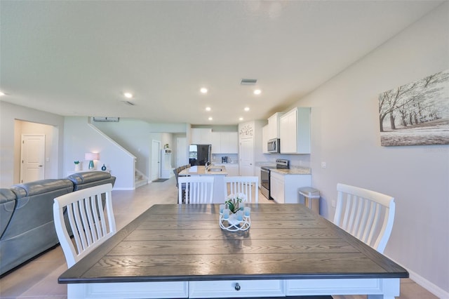 dining room featuring stairs, baseboards, visible vents, and recessed lighting