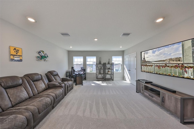 living room with light carpet, visible vents, and recessed lighting