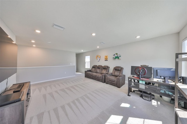 living area featuring baseboards, carpet floors, visible vents, and recessed lighting