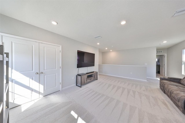 living room featuring recessed lighting, baseboards, visible vents, and light colored carpet