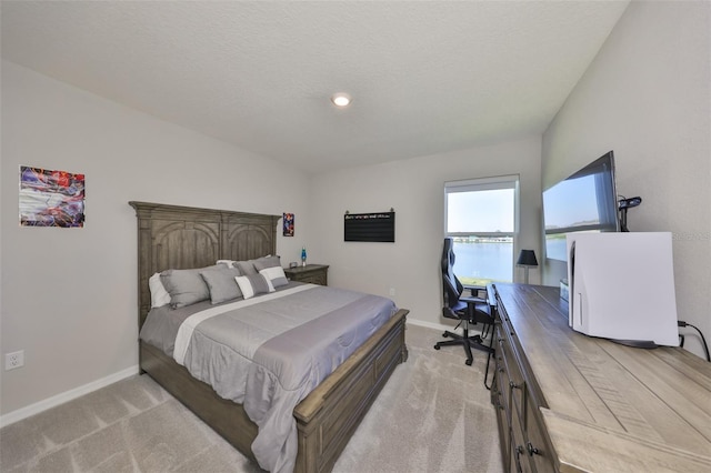 carpeted bedroom with baseboards