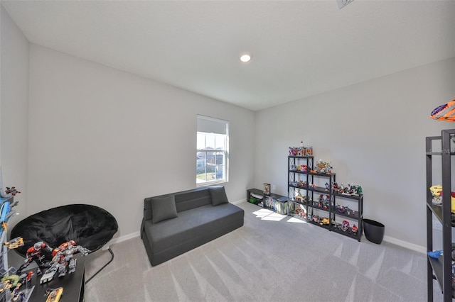 living area with carpet floors, baseboards, and recessed lighting