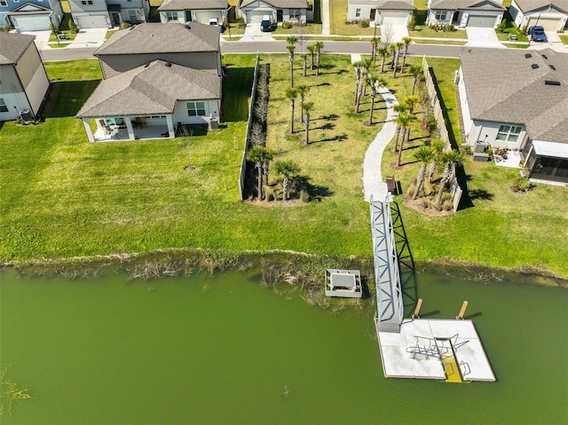 bird's eye view with a residential view and a water view