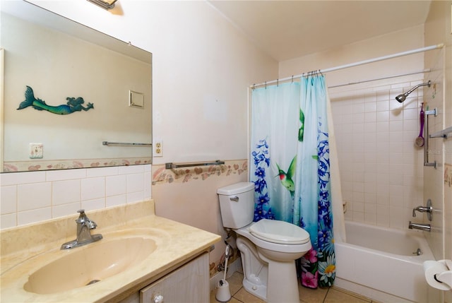 bathroom featuring toilet, a wainscoted wall, vanity, tile patterned floors, and shower / bath combination with curtain