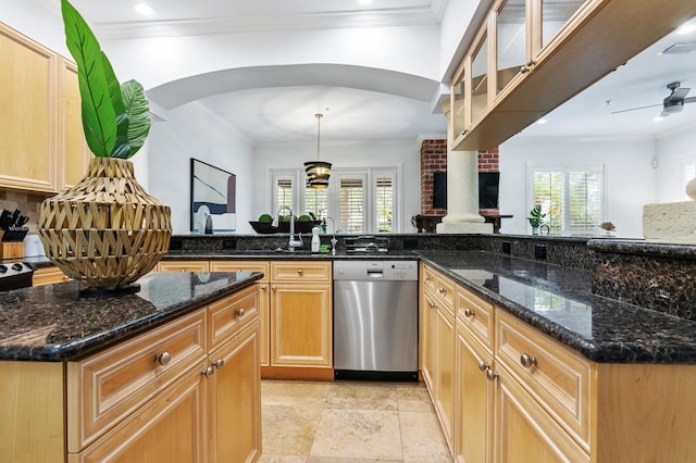 kitchen with arched walkways, dark stone counters, dishwasher, ceiling fan, and crown molding