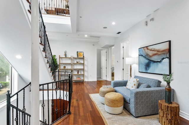 living room featuring a wealth of natural light, baseboards, recessed lighting, and wood finished floors