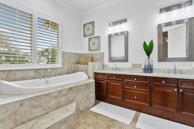 full bathroom with ornamental molding, a washtub, a sink, and double vanity