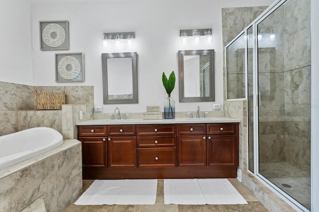 full bath featuring a stall shower, a garden tub, a sink, and double vanity