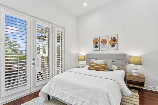 bedroom with dark wood-style floors, access to outside, baseboards, and recessed lighting