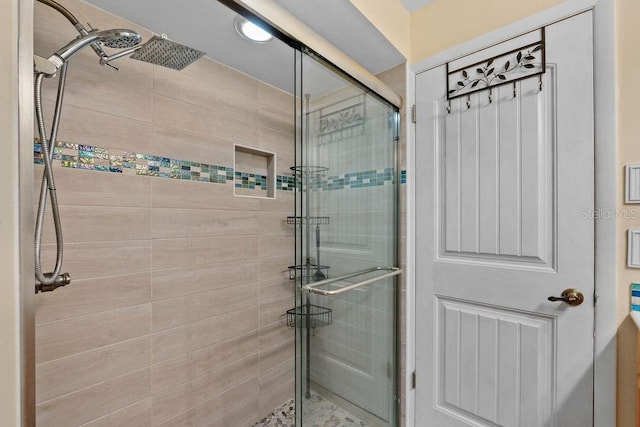 bathroom featuring a shower stall