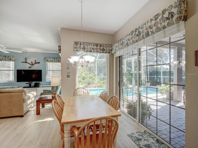 dining area featuring a chandelier and wood finished floors