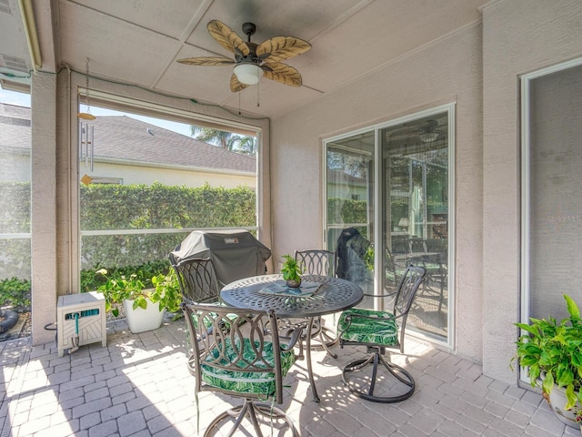 sunroom / solarium with ceiling fan