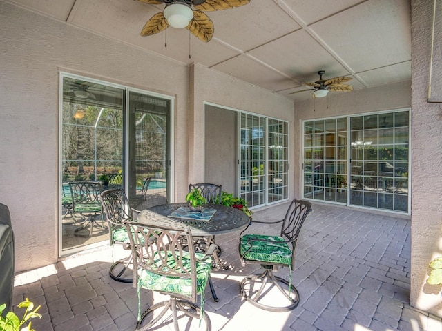 view of patio featuring ceiling fan