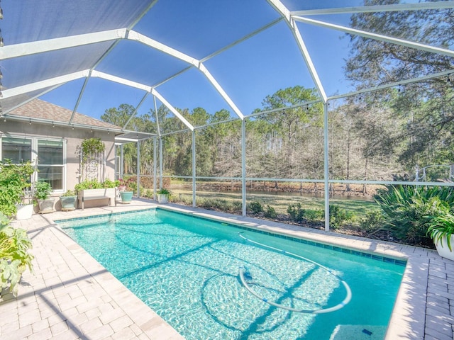 pool featuring a lanai and a patio area