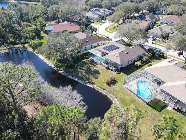 bird's eye view with a water view and a residential view