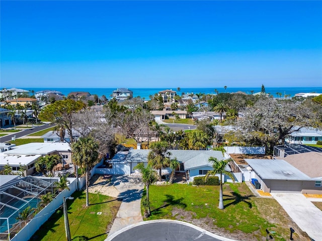 birds eye view of property featuring a residential view and a water view