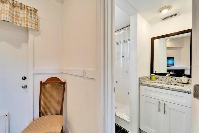 full bathroom featuring a shower stall, visible vents, radiator heating unit, and vanity