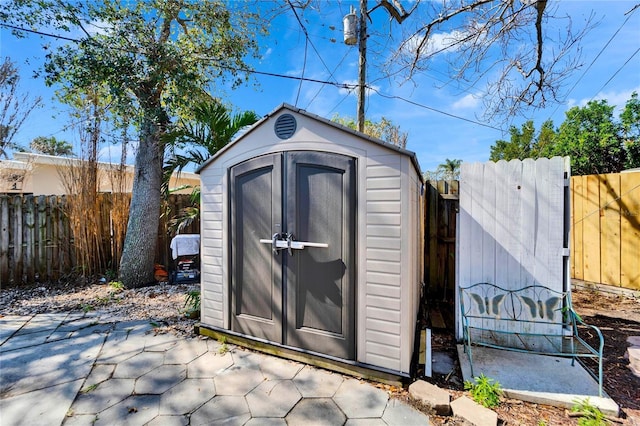 view of shed with a fenced backyard