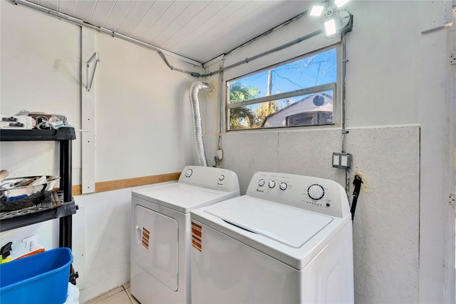 laundry area with laundry area, wooden ceiling, and washing machine and clothes dryer