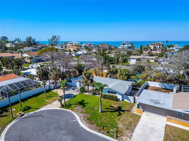 bird's eye view featuring a water view and a residential view