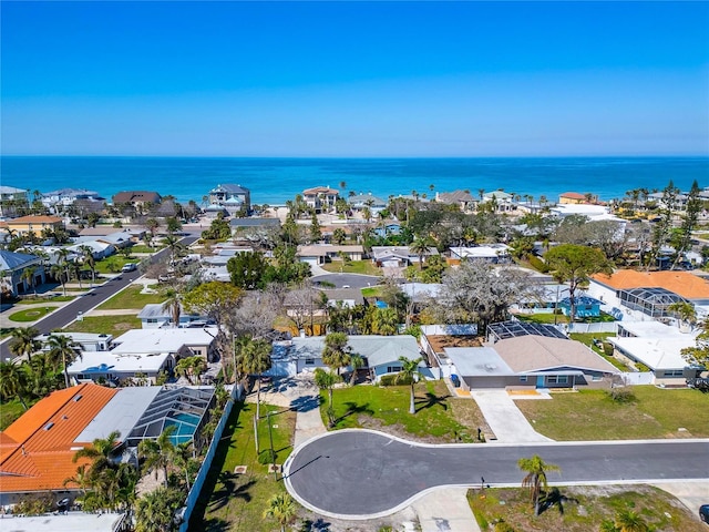 birds eye view of property featuring a water view and a residential view