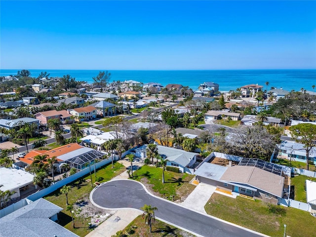 birds eye view of property with a residential view and a water view