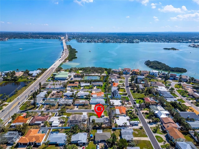 birds eye view of property featuring a residential view and a water view