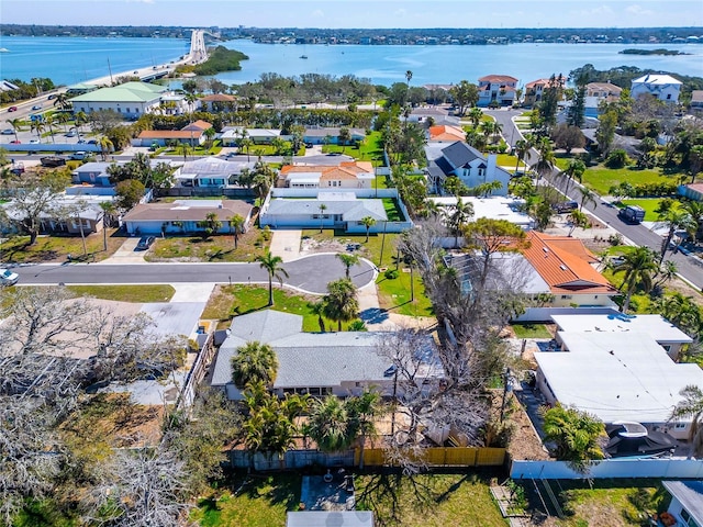 drone / aerial view with a water view and a residential view