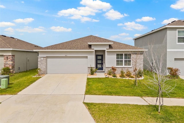 prairie-style home with a garage, stone siding, and a front lawn