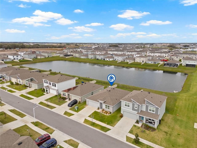 bird's eye view with a water view and a residential view