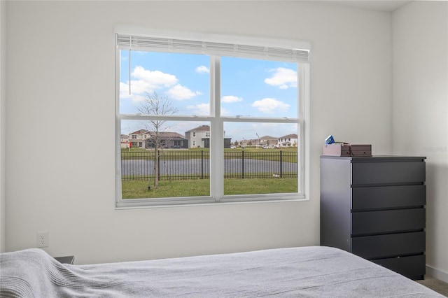 bedroom featuring a water view