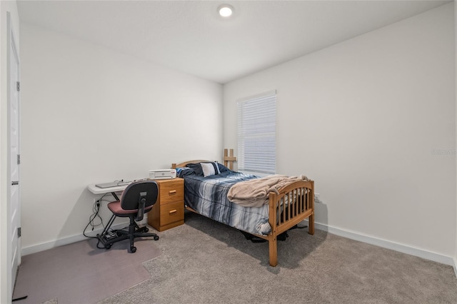 bedroom featuring carpet flooring and baseboards