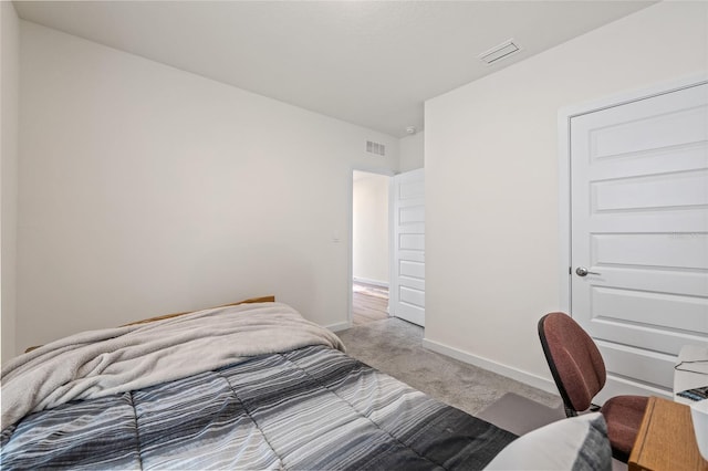 bedroom featuring baseboards, visible vents, and carpet flooring