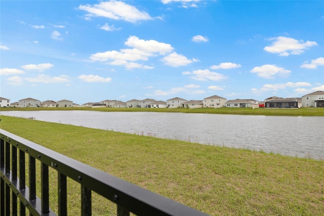 water view with fence and a residential view