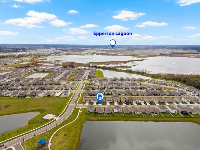 bird's eye view featuring a water view and a residential view