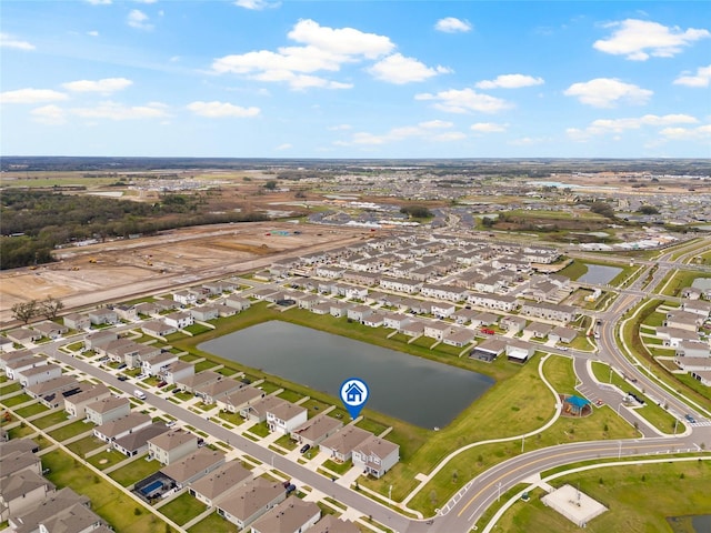 bird's eye view with a water view and a residential view