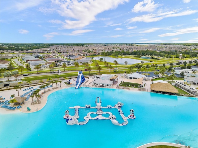 view of pool with a water view