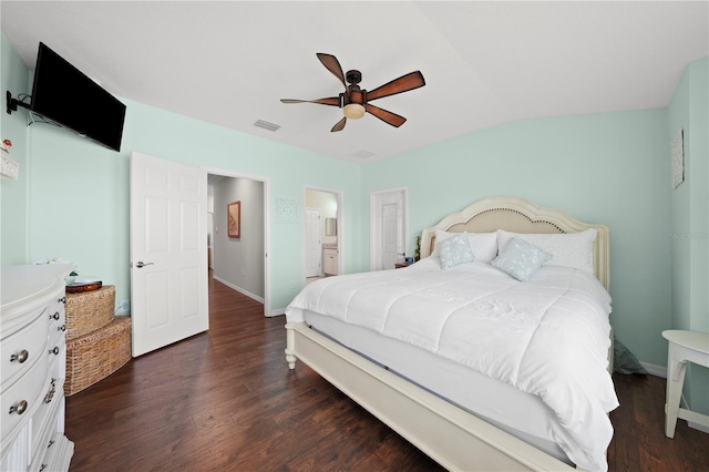 bedroom with visible vents, dark wood-type flooring, baseboards, ceiling fan, and vaulted ceiling