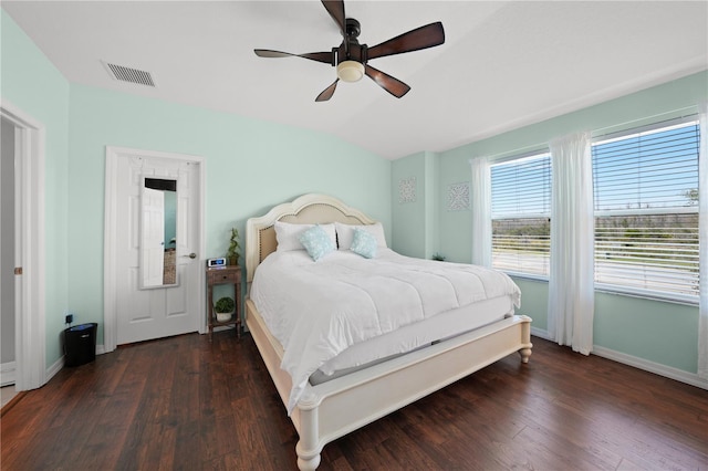 bedroom with vaulted ceiling, a ceiling fan, baseboards, and wood finished floors