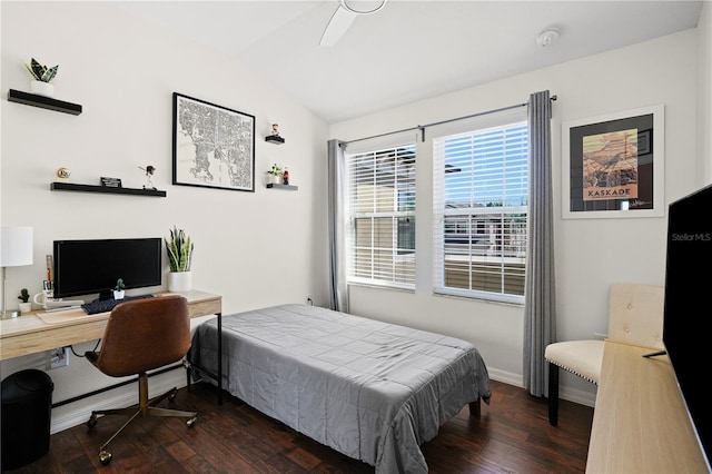 bedroom featuring baseboards, lofted ceiling, and dark wood-style flooring