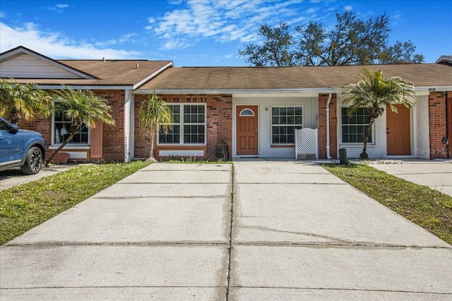 ranch-style house with brick siding