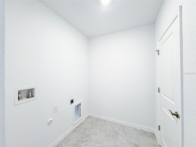 clothes washing area featuring gas dryer hookup, hookup for an electric dryer, laundry area, washer hookup, and baseboards